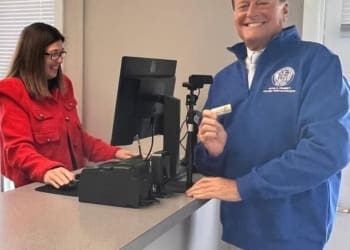 Colonie Town Supervisor Peter Crummey and parks staff member Tara Booker testing the new online system at the Town’s Parks and Recreation Department.       Photo provided