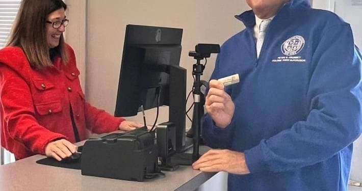 Colonie Town Supervisor Peter Crummey and parks staff member Tara Booker testing the new online system at the Town’s Parks and Recreation Department.       Photo provided