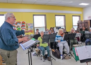 Vince Bonafede, conductor for the Albany Area Senior Orchestra, conducting a rehearsal at St. Matthew St. Paul's Lutheran Church in Albany on Tuesday, March 19. Bonafede will debut his "Albany Suite" to the public in Delmar on April 2.