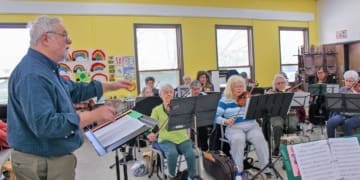 Vince Bonafede, conductor for the Albany Area Senior Orchestra, conducting a rehearsal at St. Matthew St. Paul's Lutheran Church in Albany on Tuesday, March 19. Bonafede will debut his "Albany Suite" to the public in Delmar on April 2.